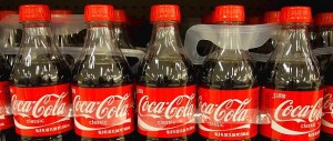 DOCU_GRUPO Bottles of Coca-Cola sit on a supermarket shelf in Gilbert, Arizona
